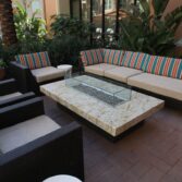 Custom automated Montecito fire pit table with Cafe Creme granite top.