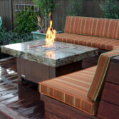 Balboa fire pit table, granite and copper plated base.