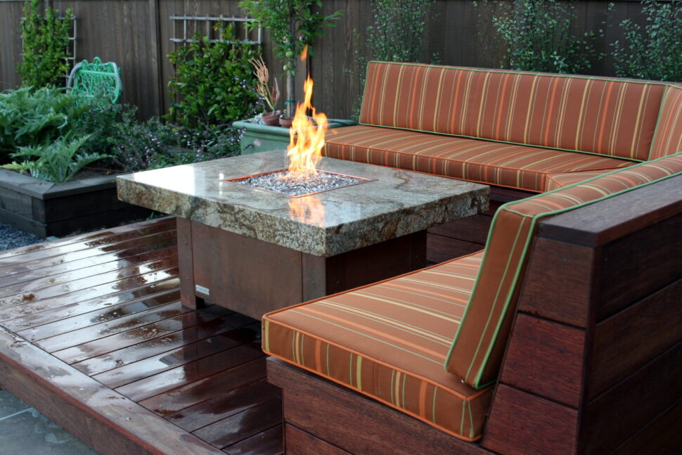 Balboa fire pit table, granite and copper plated base.